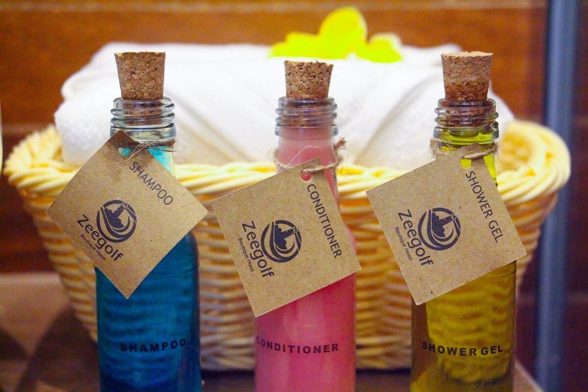 Refillable glass toiletries in a wicker basket